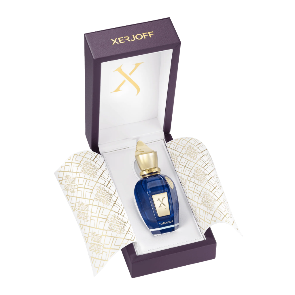Torino 24 EDP perfume bottle in blue with gold cap inside an elegant purple and white presentation box with gold details
