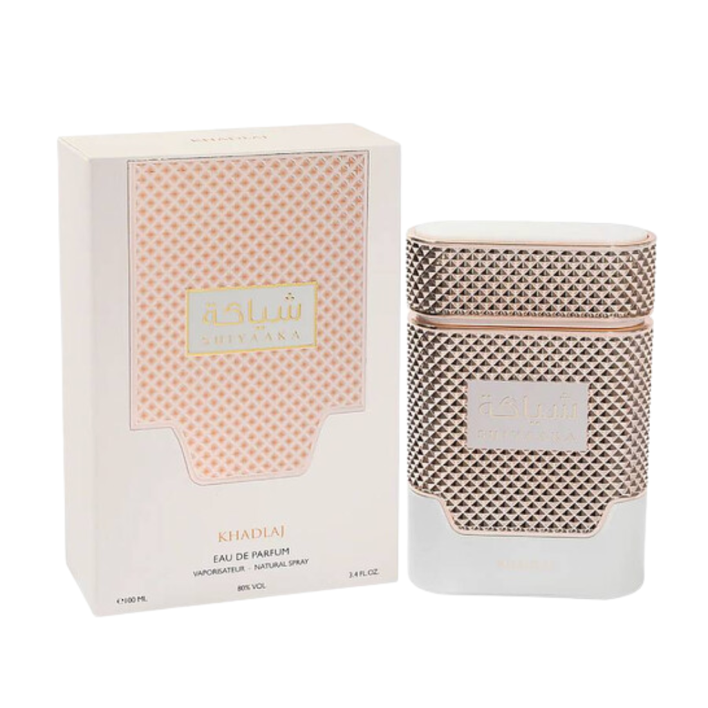 Shiyaaka White EDP bottle and box with elegant textured gold and white design, luxury fragrance decant packaging.