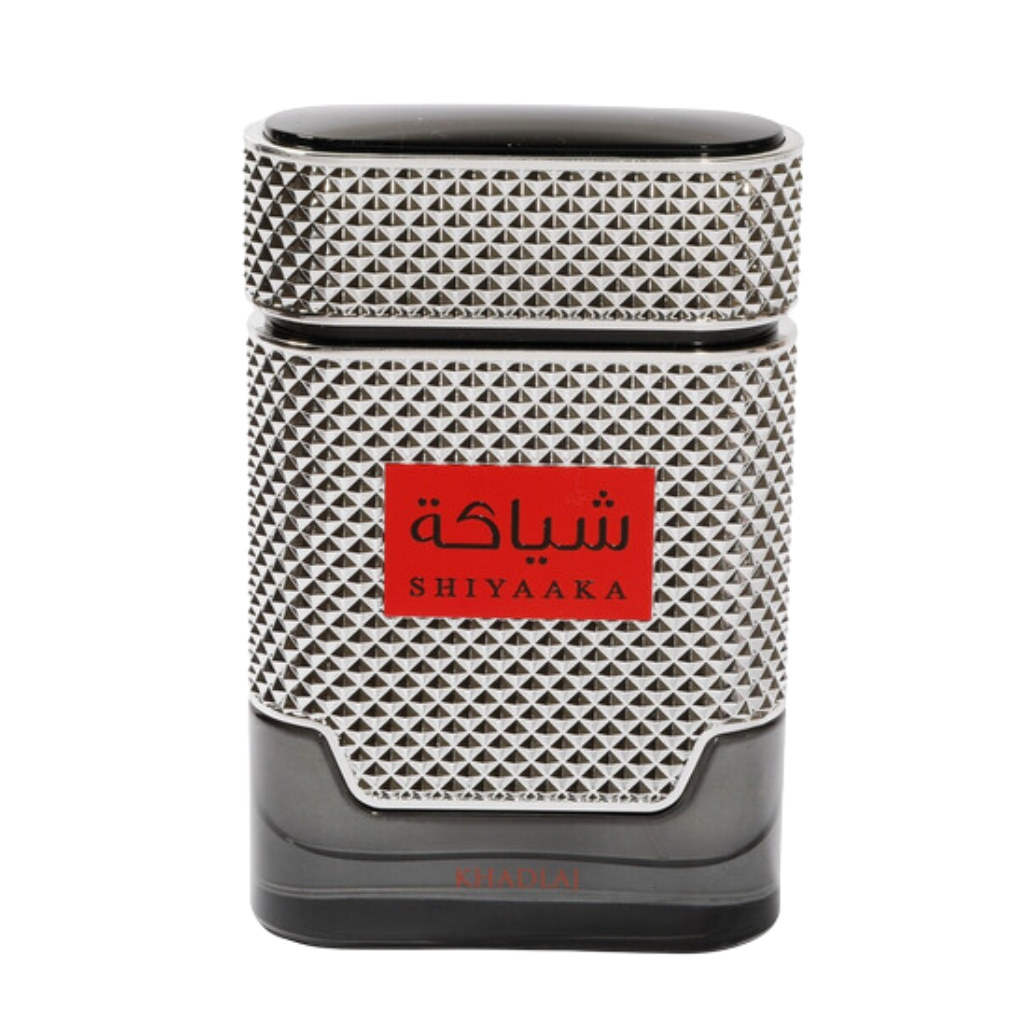 Shiyaaka Silver EDP perfume bottle with textured silver design and red label on dark base background