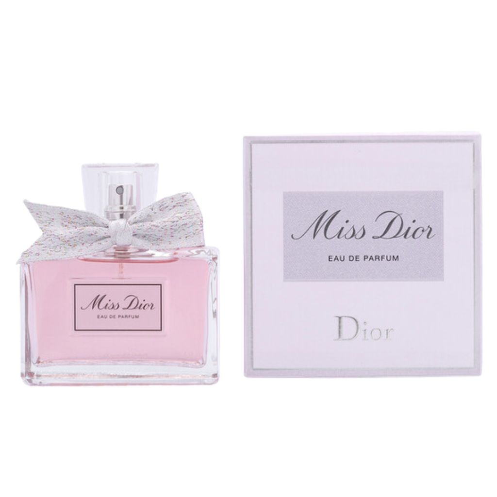 Miss Dior EDP perfume bottle with pink liquid and elegant white bow next to matching white box packaging