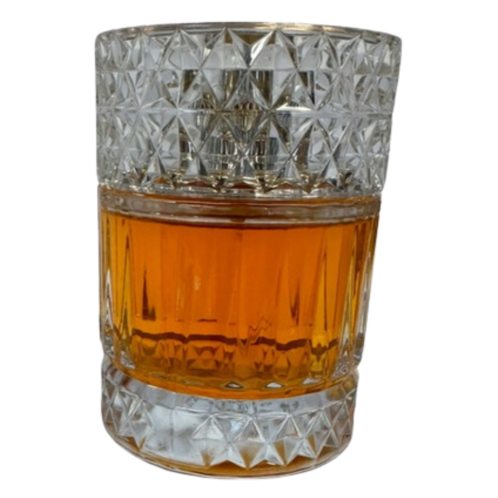 Elegant glass bottle filled with amber liquid of Sharaf Blend Extrait de Parfum, a sophisticated niche fragrance decant.