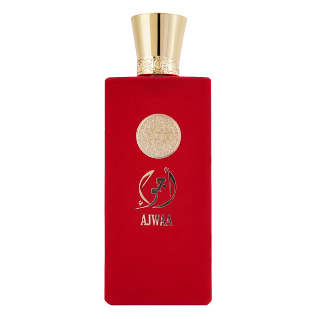 Ajwaa Concentrated EDP in a luxurious red velvet bottle with gold embossed details and a shiny gold cap.