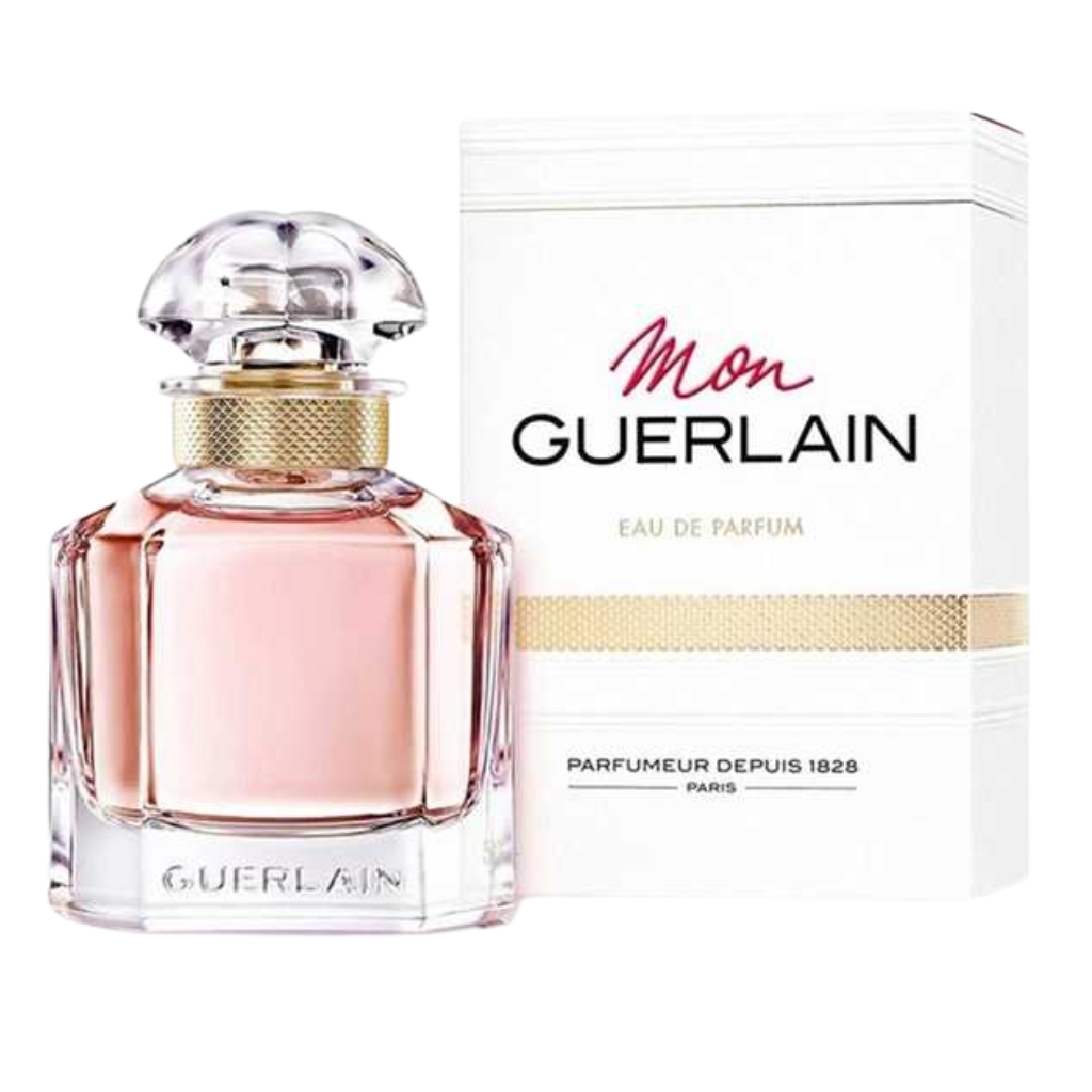 Mon EDP perfume bottle with pale pink liquid next to its white and gold accented packaging box