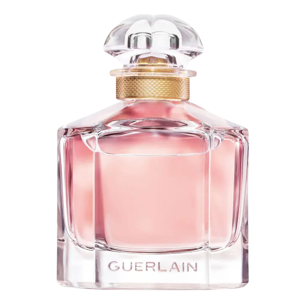 Elegant clear glass perfume bottle with blush pink liquid and gold accent, labeled Mon EDP by Guerlain