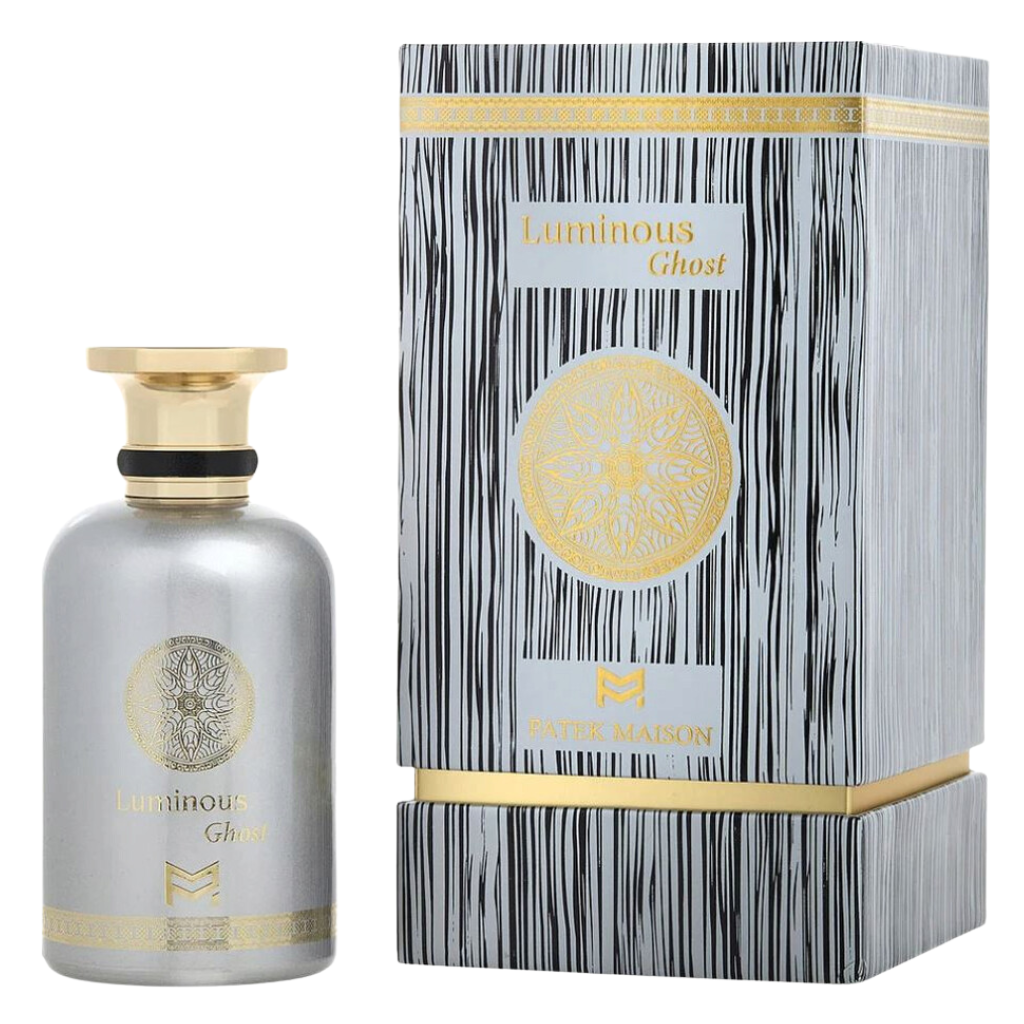 Luminous Ghost EDP perfume bottle in silver with gold accents beside a patterned black and white box with gold detailing