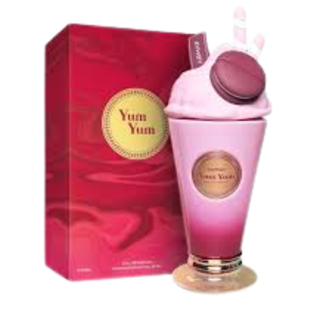 Yum Yum EDP bottle shaped like a pink dessert with macaron and candy decorations beside a red and gold branded box