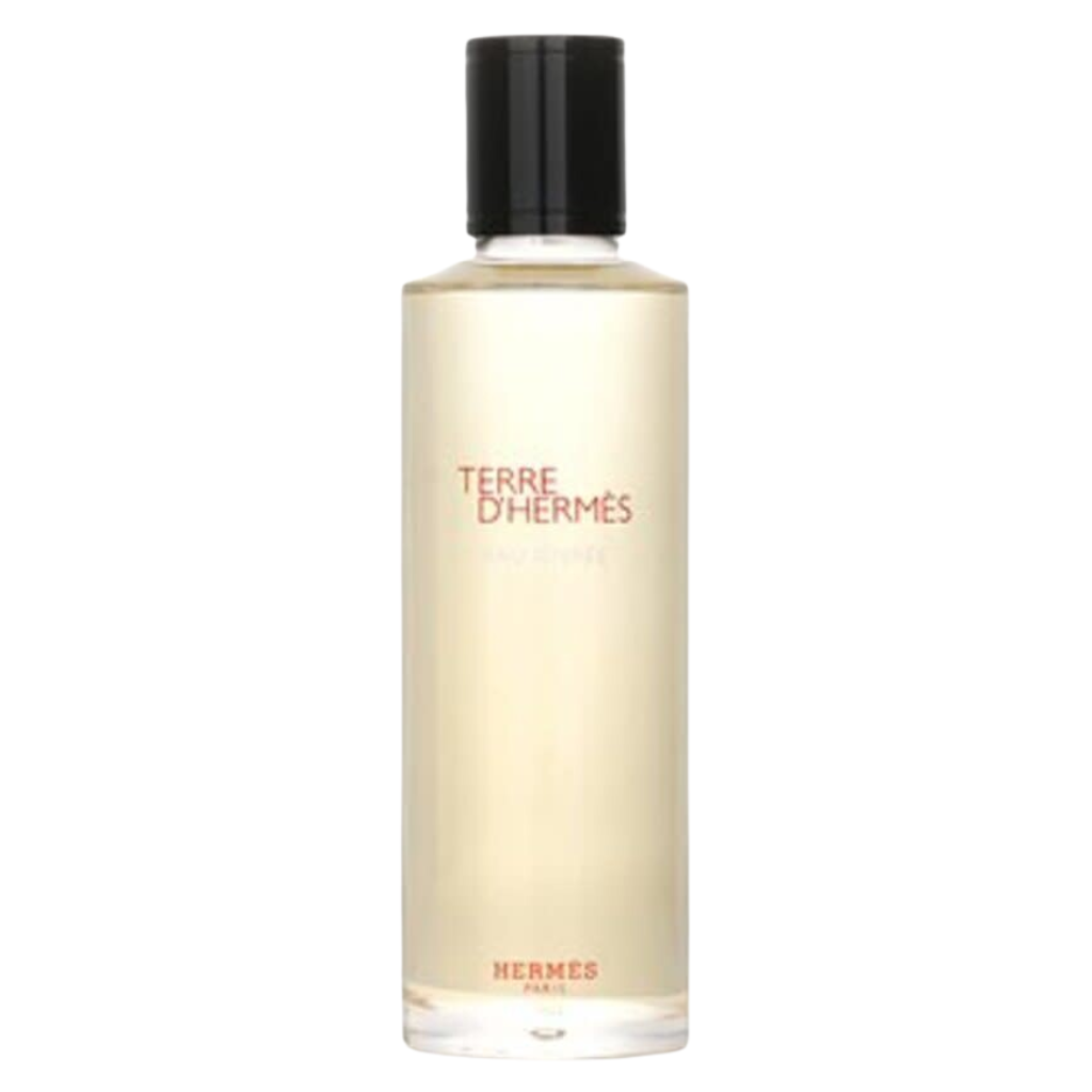 Clear bottle of Terre d'Hermes Eau Givree EDP with black cap and light beige colored fragrance inside